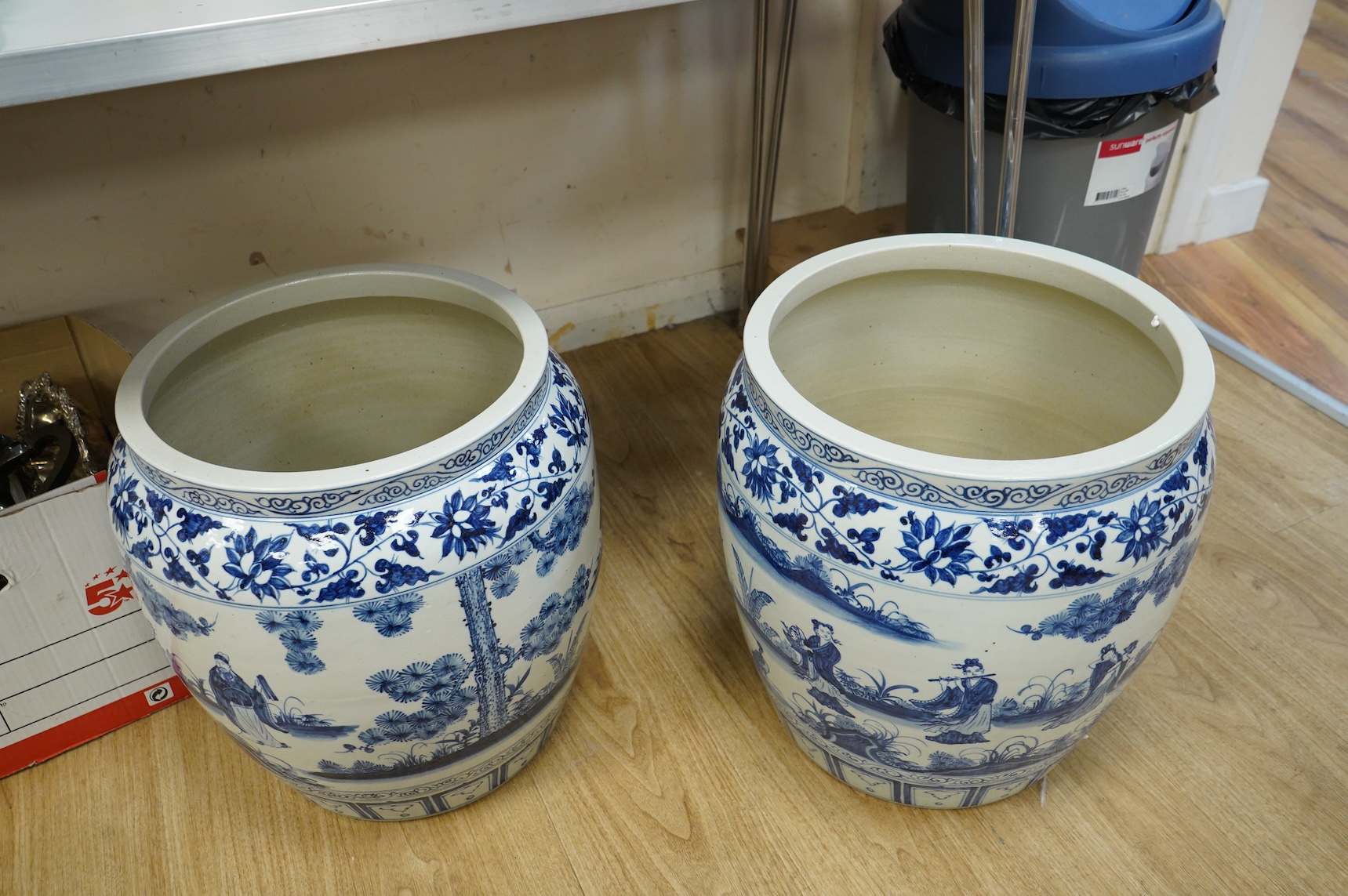A large pair of Chinese blue and white planters, 43cm high.